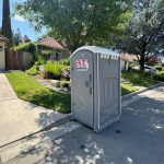 Standard porta potty for Clovis backyard wedding